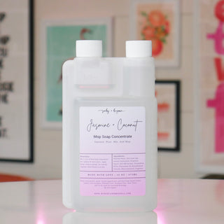 Mop soap concentrate with a light purple label, titled 'Jasmine & Coconut'. 