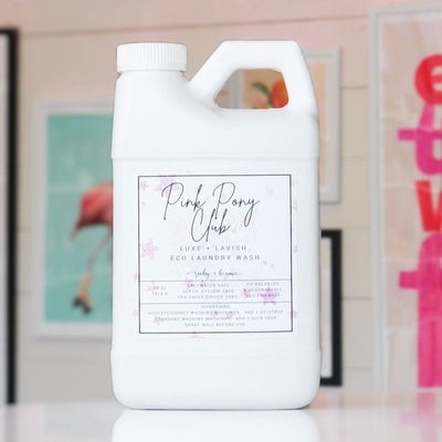 White laundry detergent container with 'Pink Pony Club' label.