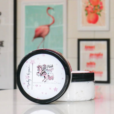 Whipped body frosting jars with a white label featuring a girl riding a pink horse, titled 'Pink Pony Club'. 