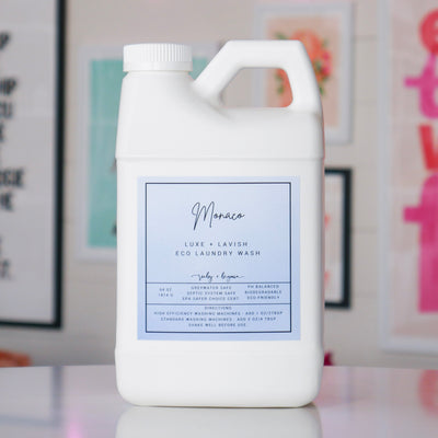 White laundry detergent container with a light blue label, titled 'Monaco'.