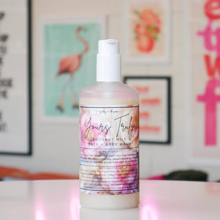 Bottle of coconut milk face and body wash with floral design, labeled Yours Truly.
