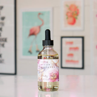 Bottle of Coco Vegan diffuser oil with a floral design, labeled Yours Truly.