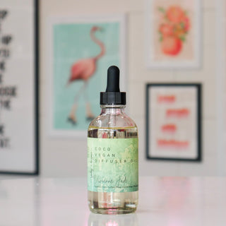 Bottle of Coco Vegan Diffuser Oil with a dropper, labeled Vivienne Jade. 