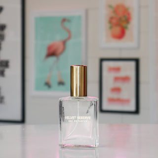 Clear glass bottle with gold cap, labeled 'Velvet Reserve'. 