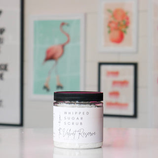 Jar of whipped sugar scrub labeled 'Velvet Reserve'.