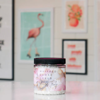 Jar of whipped sugar scrub with floral design, labeled Yours Truly.