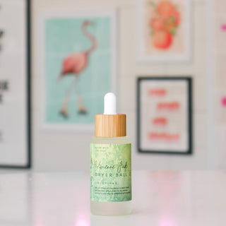 Bottle of Dryer Ball Oil with wooden dropper, titled Vivienne Jade. 