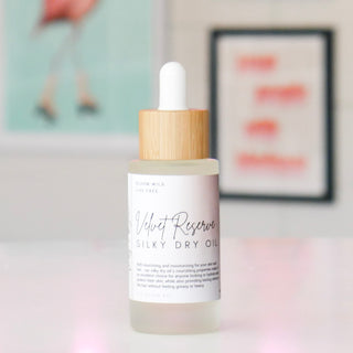 Silky dry oil bottle with wooden dropper, labeled 'Velvet Reserve'.