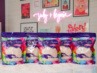 Assortment of bath soak bags, labeled with an array of scents.