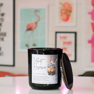 Black candle with a label titled 'Velvet Reserve'.