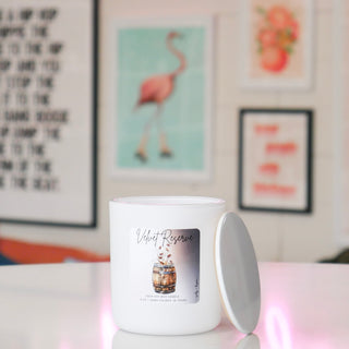 White candle with a label titled 'Vivienne Jade'.