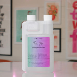 Mop soap concentrate bottle with a blue/purple label, titled 'Rainstorm'.