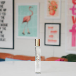 Clear glass rollerball perfume, labeled Vivienne Jade.