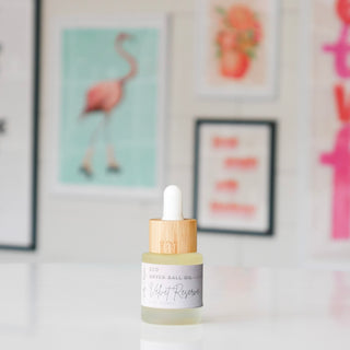 Small dryer ball oil bottle with wooden dropper, labeled 'Velvet Reserve'.