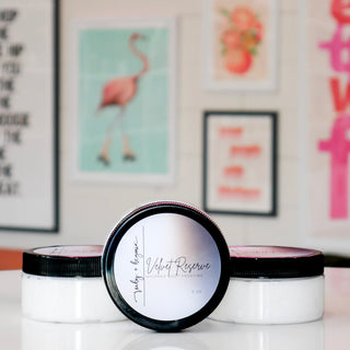 Three whipped body frosting jars labeled 'Velvet Reserve'.