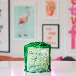 Candle refill wrapped in green paper, labeled with a green floral design, titled Vivienne Jade.