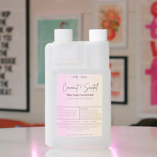 Mop soap concentrate with a pink/cream label, 'Coconut & Santal'. 