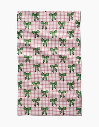 Pink checkered towel with green bow pattern